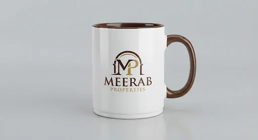 Two-tone ceramic mug printed with the Meerab Properties logo