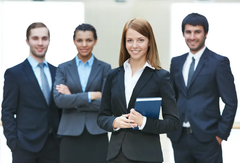Office team in tailored corporate suits and blazers