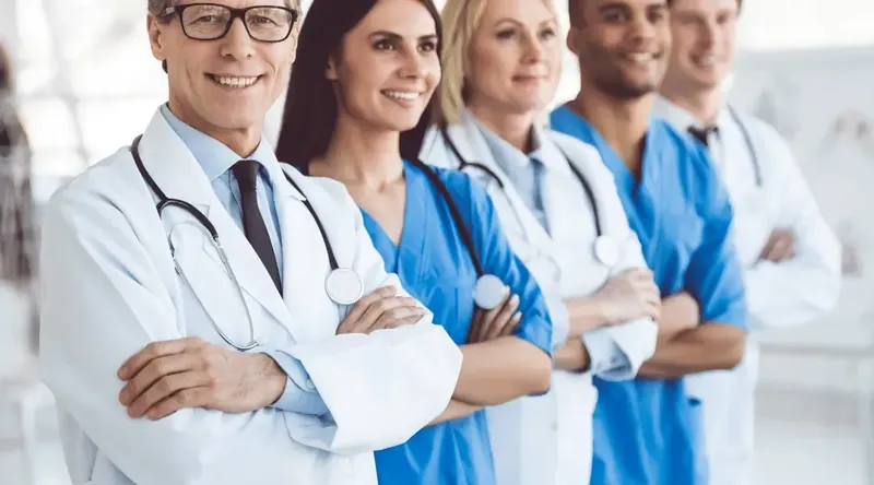 Doctors and nurses in lab coats and medical scrubs