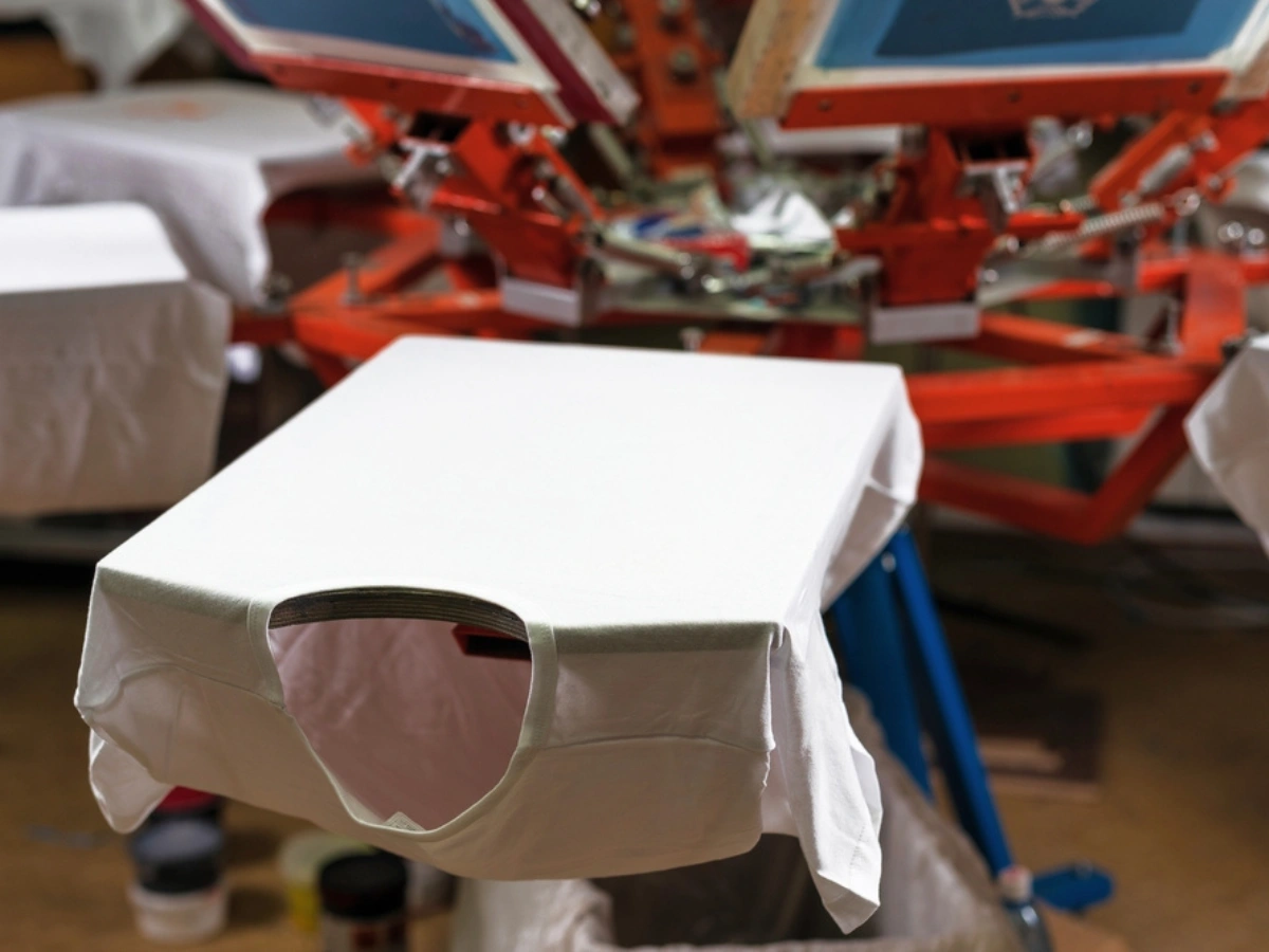 White t-shirts prepared for high-quality branding using advanced UV Printing Services in UAE.